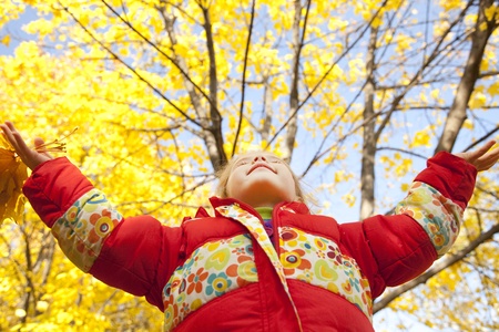 Child in autumn park. Outdoor.