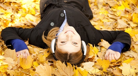 Portrait of a woman at outdoor with headphones.の写真素材
