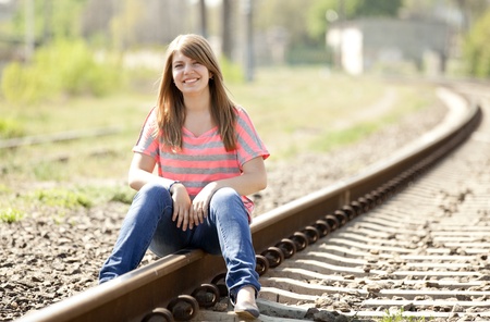 Teen girl at railways.の写真素材