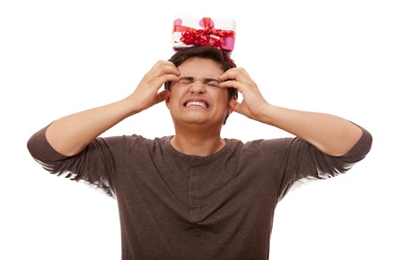 An angry man holding present box on white background.の写真素材