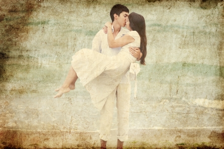 Couple kissing at the beach. Photo in old retro style.の写真素材
