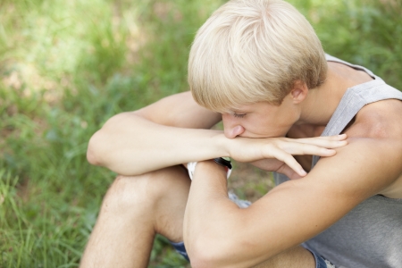 Teen boy at green park.の写真素材