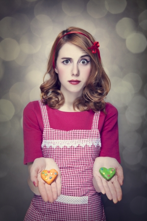 Redhead women with cookiesの写真素材