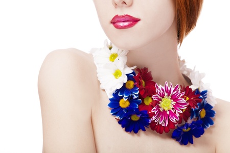 Beautiful redhead girl with flowersの写真素材