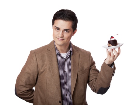 Man in suit holds cake, isolated on whiteの写真素材