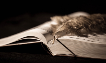 Pen on old book. Photo in old vintage styleの写真素材