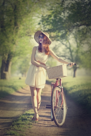 Girl on a bike in the countryside.の写真素材