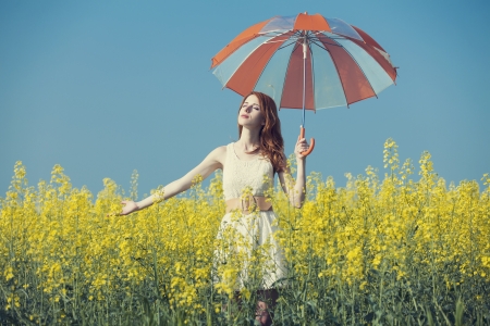 Redhead girl at fieldの写真素材