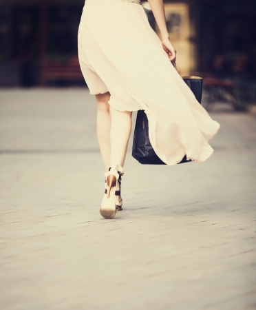 Back side view on fashion women wtih bagsの写真素材