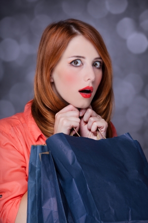 Redhead women with sopping bags.の写真素材