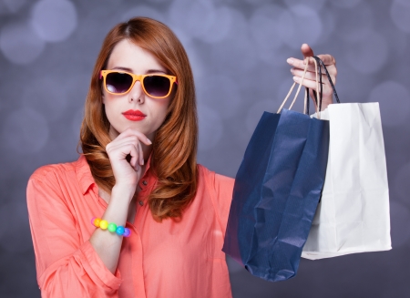 Redhead women with sopping bags.の写真素材