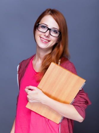 Redhead student with notes.の写真素材