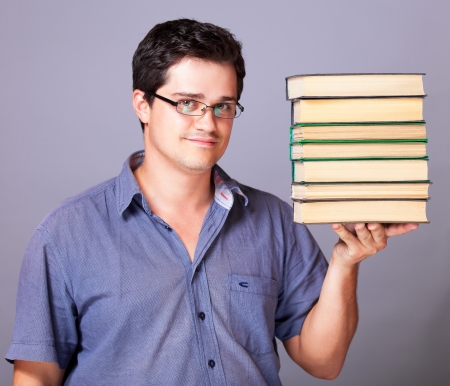 Man with books. Studio shotの写真素材