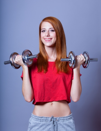 Girl with dumbbellsの写真素材