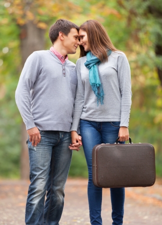 couple kissing outdoor in the parkの写真素材