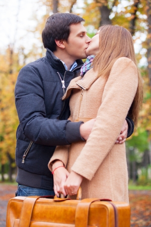 couple kissing outdoor in the parkの写真素材