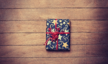 Christmas gift box on wooden tableの写真素材