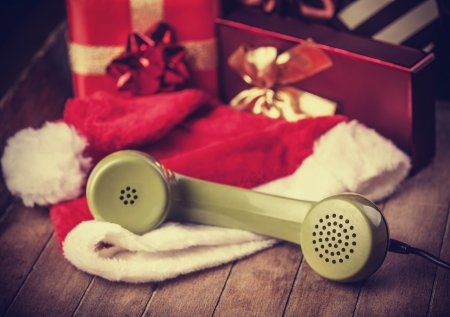 handset and christmas gifts at backgroundの写真素材