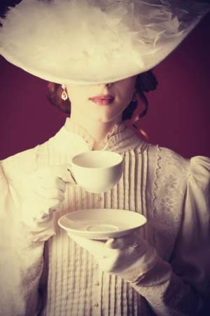 Beautiful redhead women with cup of tea Beautiful redhead women with cup of tea