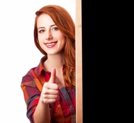 Redhead girl with blackboard on white の写真素材