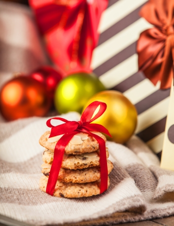 Cookies with christmas gifts at backgroundの写真素材