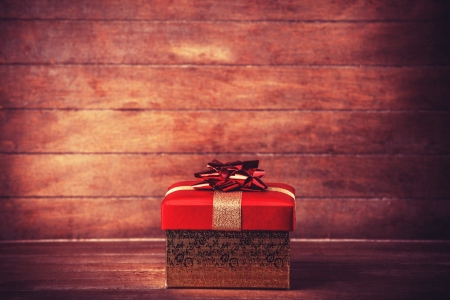 Retro gift on wooden table. Photo in vintage color image style.の写真素材
