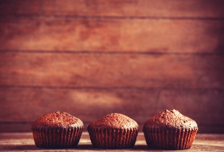 Muffin on wooden table. の写真素材