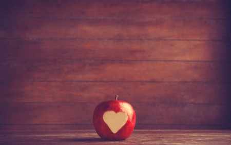Apple with a heart cut into it. の写真素材