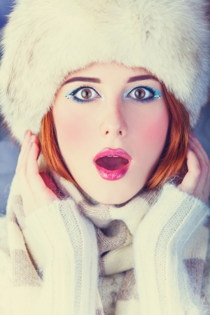 Redhead women on christmas background.の写真素材