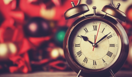 Vintage clock on christmas . Photo in retro color image style.