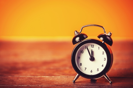 Retro alarm clock. Photo in retro color image styleの写真素材