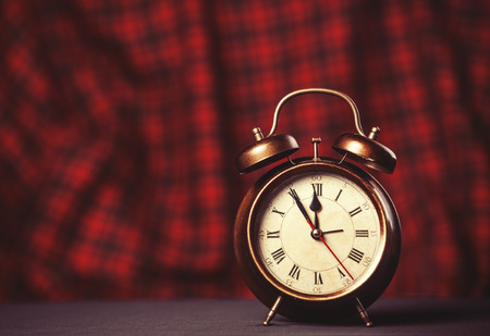 Retro alarm clock. Photo in vintage color image style.の写真素材