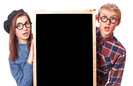 Nerd teen couple with blackboard.