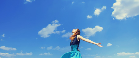 Redhead girl at windy fieldの写真素材