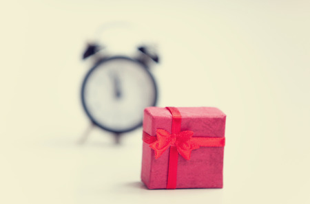 Retro alarm clock and gift. Isolatedの写真素材