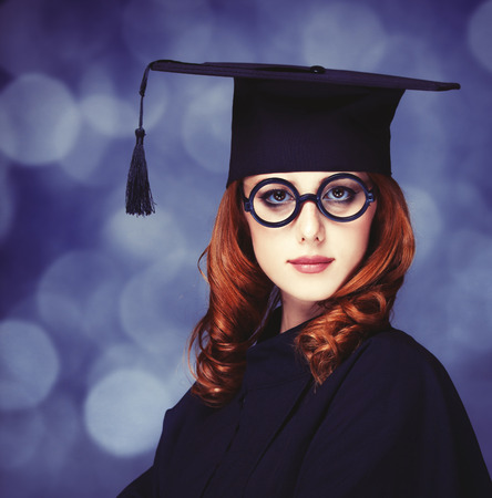 graduating student girl in an academic gown.の写真素材