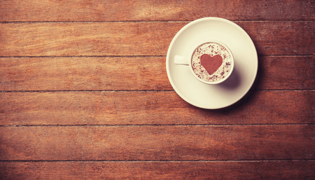 Cup of offee on a wooden table.の写真素材
