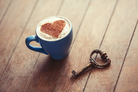 Cup with heart and key.の写真素材