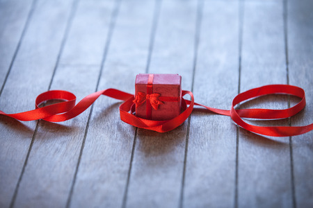Christmas gift box on wooden tableの写真素材