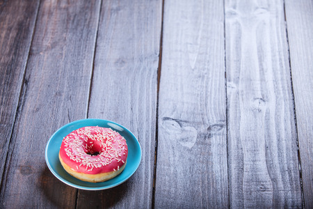 Donut on wooden table.の写真素材