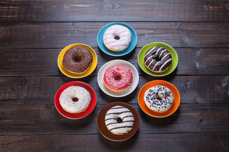 Donuts on wooden table.の写真素材
