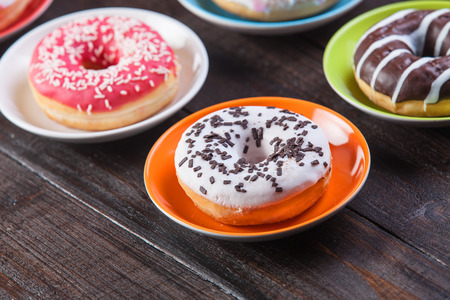 Donuts on wooden table.の写真素材