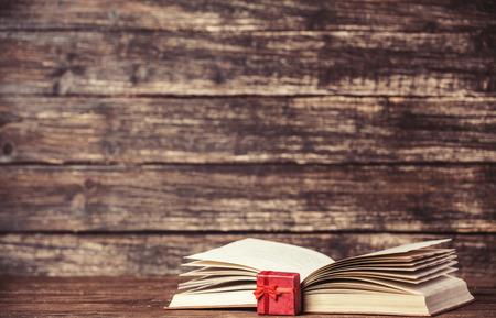 Present box and open book.