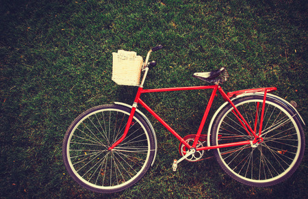 Vintage bicycle waiting on grassの写真素材