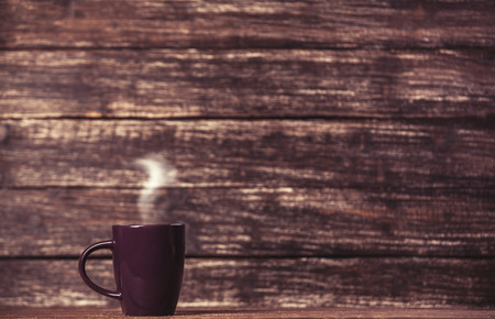 Tea or coffee cup on wooden table.の写真素材