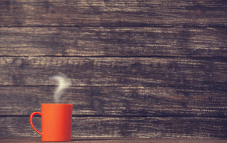 Tea or coffee cup on wooden table.の写真素材