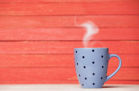 Tea or coffee cup on wooden table.の写真素材