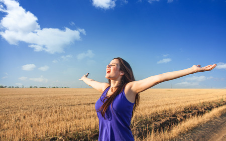 Brunette girl on country side.の写真素材