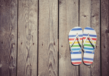beach slippers on woodの写真素材