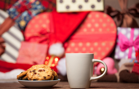 Cookie and cup of coffee on christmas background.の写真素材